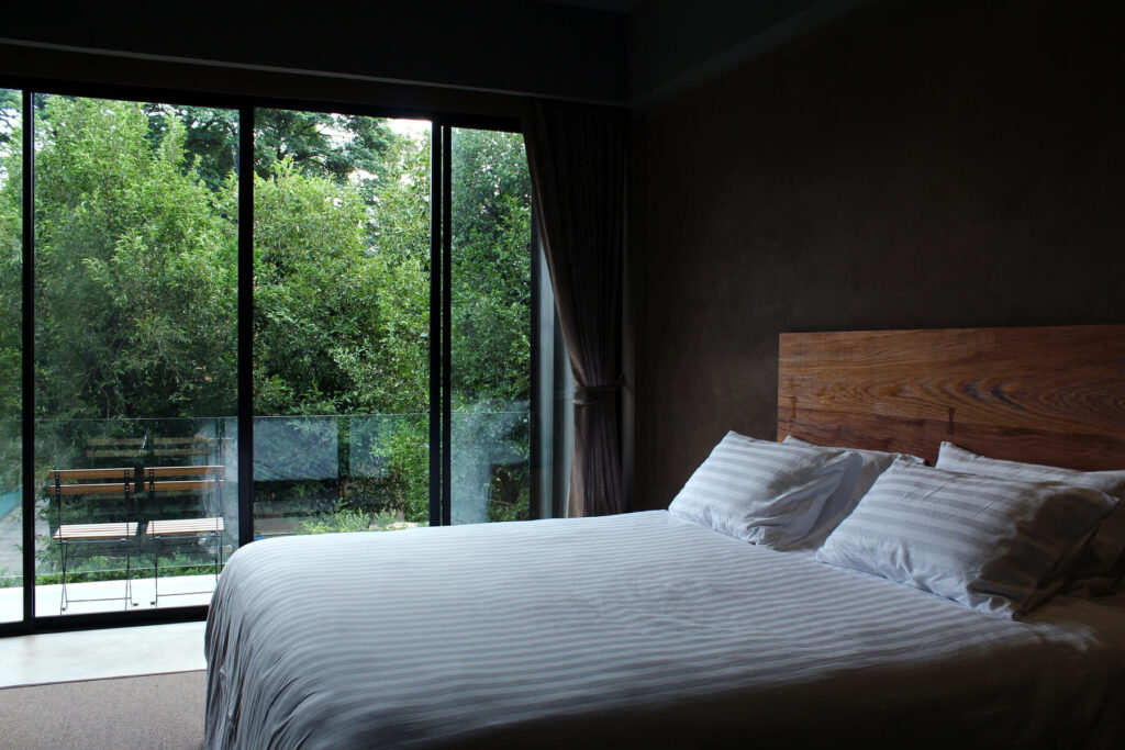 modern-bedroom-with-nature-view-2023-11-27-04-48-58-utc.jpg